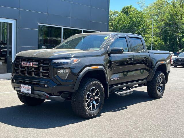 2023 GMC Canyon Crew Cab Short Box 4-Wheel Drive AT4X in Onyx Black — front three-quarter view