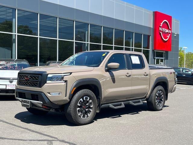 2023 Nissan Frontier Crew Cab 4x4 PRO-4X Auto in Baja Storm — front three-quarter view